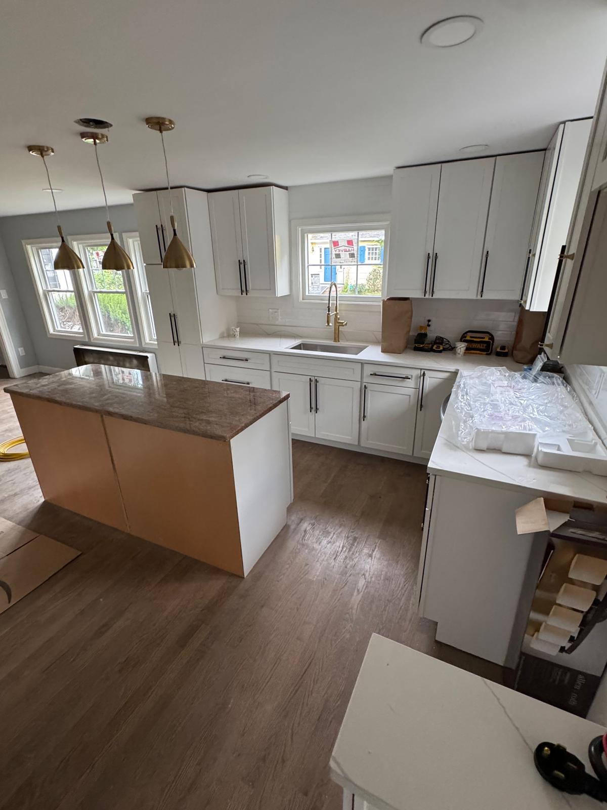Kitchen remodel — white shaker cabinets, quartz counters and a granite-topped island
