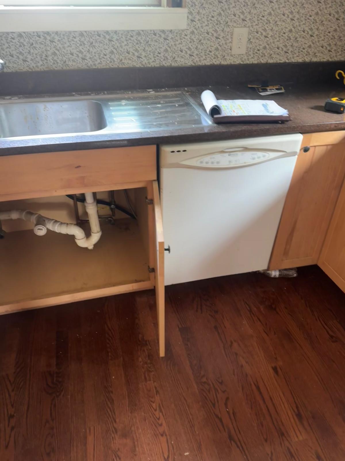 Kitchen — plumbing rough-in and cabinet install