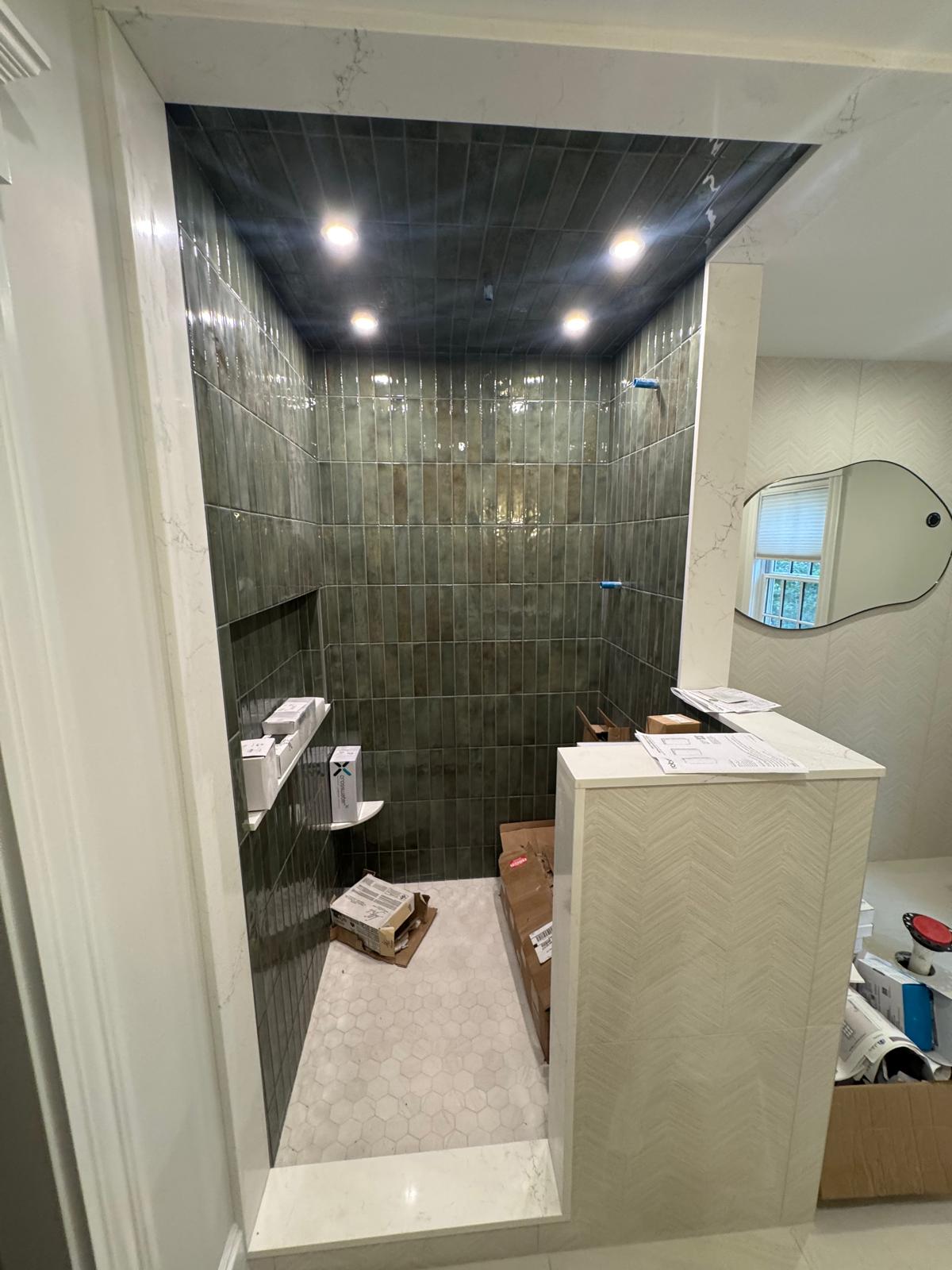 Master bathroom — walk-in shower with green zellige tile and marble bench